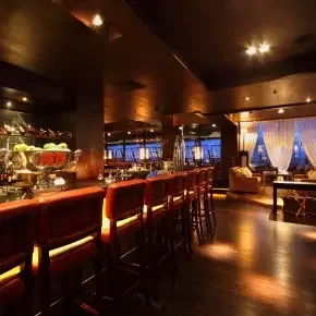 Interior of an empty bar with warm lighting.