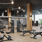 A gym space with various machines and equipment.